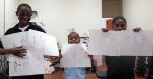 Students display their action drawings.